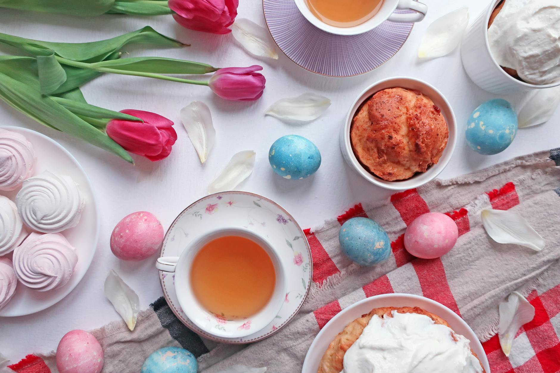 Elegant Easter brunch table with spring flowers and pastries