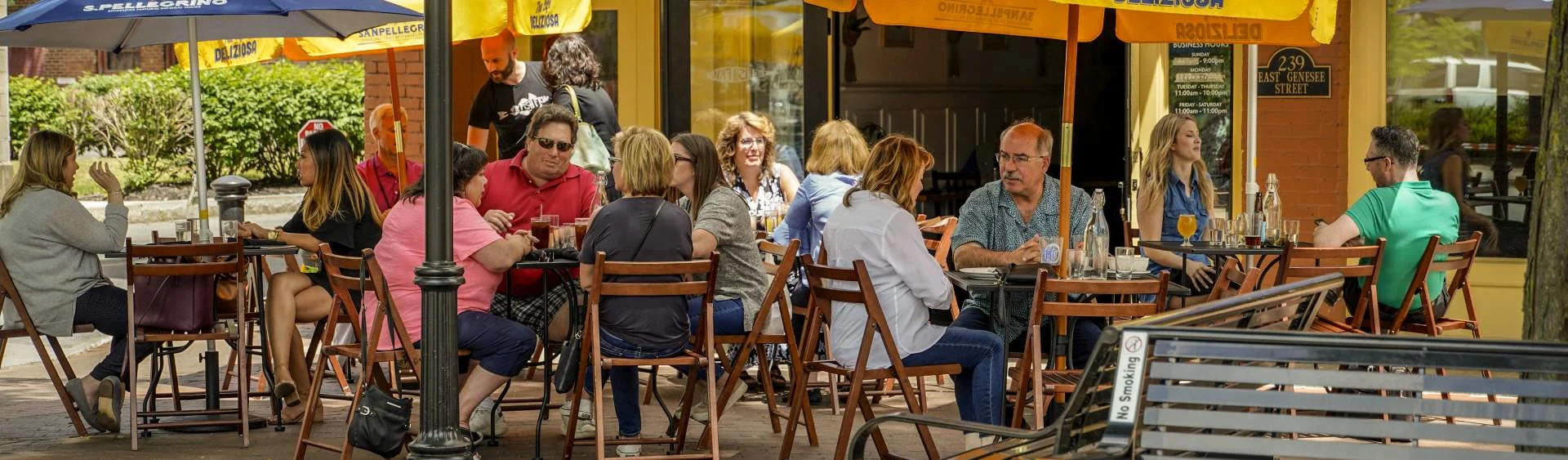 Diners enjoying outdoor seating at a downtown Syracuse restaurant in Armory Square