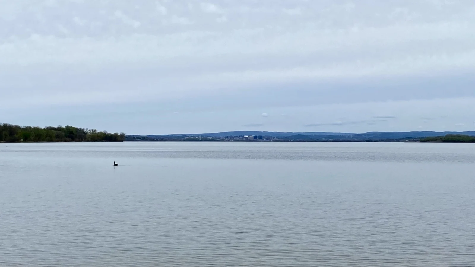 The Syracuse skyline across Onondaga Lake, with the Inner Harbor district at center.
