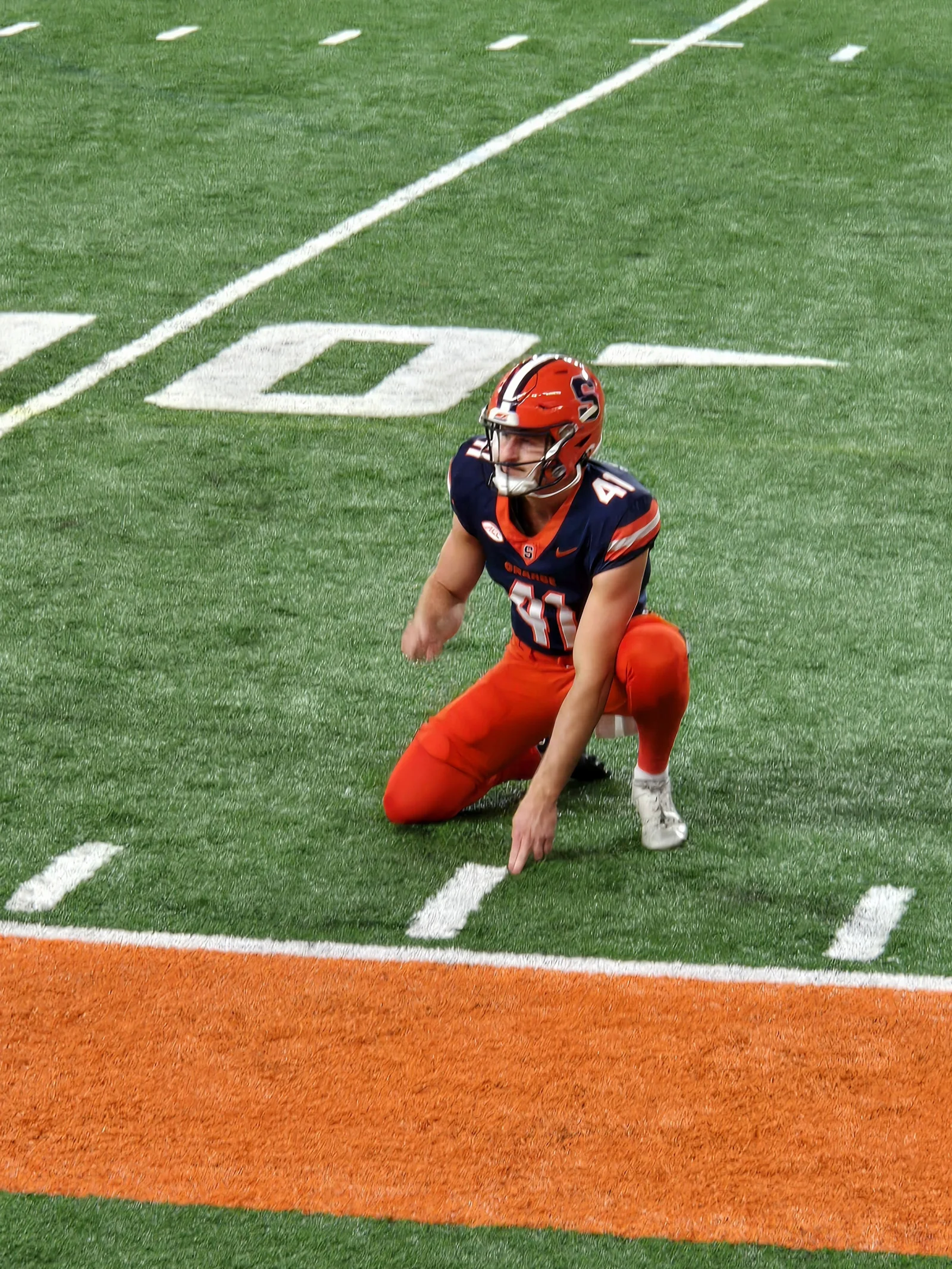 Jack Stonehouse, Syracuse Orange punter, during pre-game holding practice warmups in 2024.