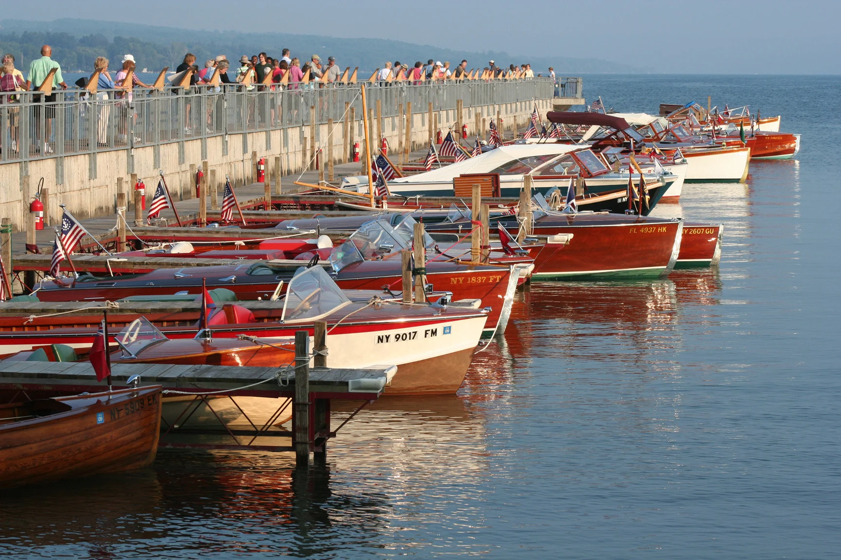 Wooden classic boats on Skaneateles Lake during the antique boat show