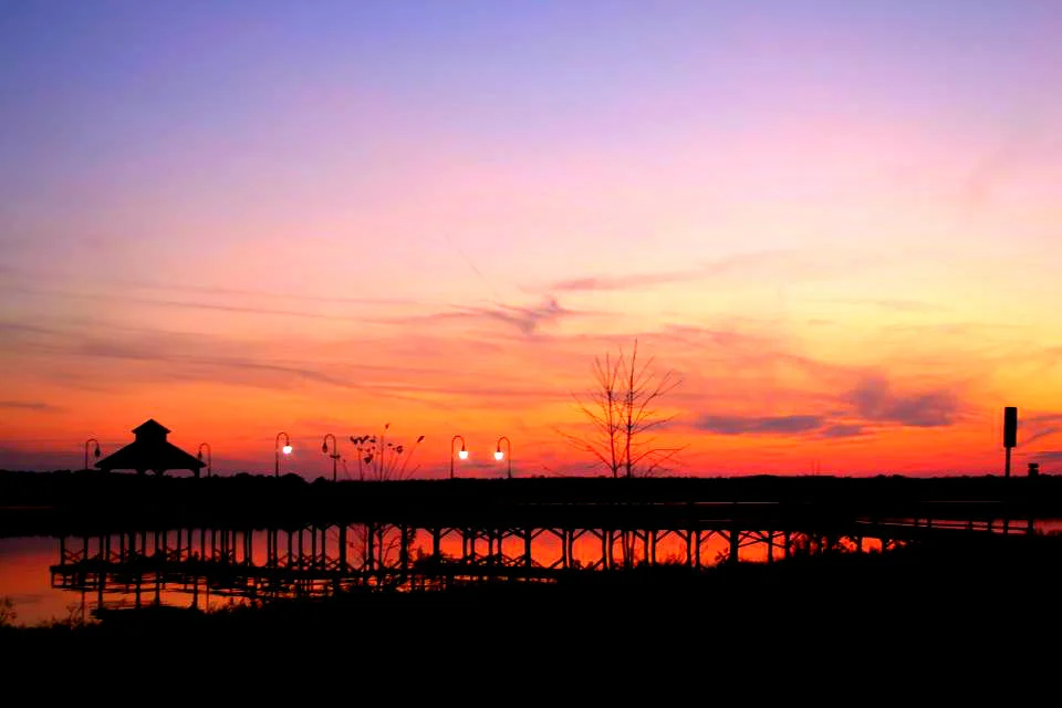 Sunset over Fulton NY waterfront in Oswego County where the Oswego River is under flooding watch