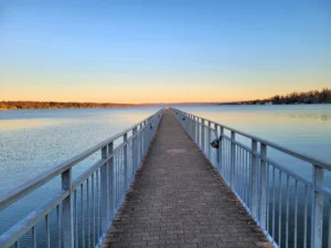 Skaneateles Lake heads into summer 2026 with one HAB on its 2024 ledger, a deeper intake under design, and a watershed that still has not built a filtration plant
