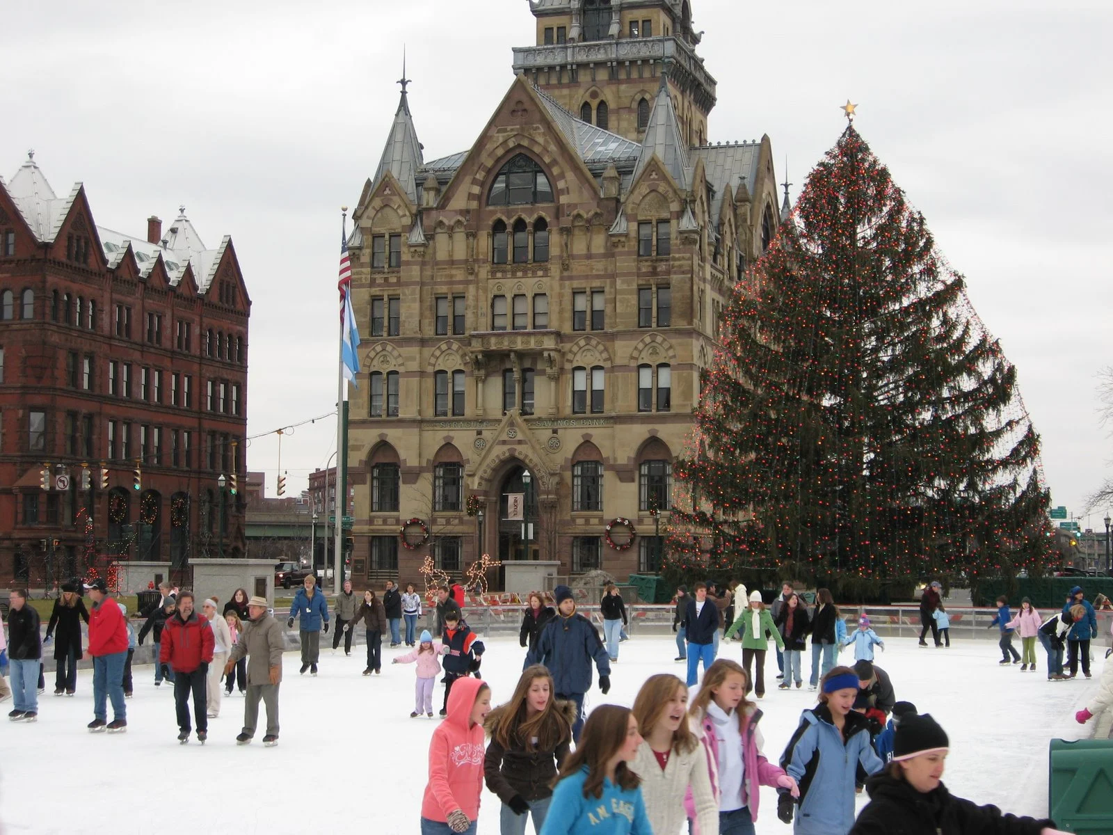 Ice skating on the Clinton Square rink in downtown Syracuse during winter