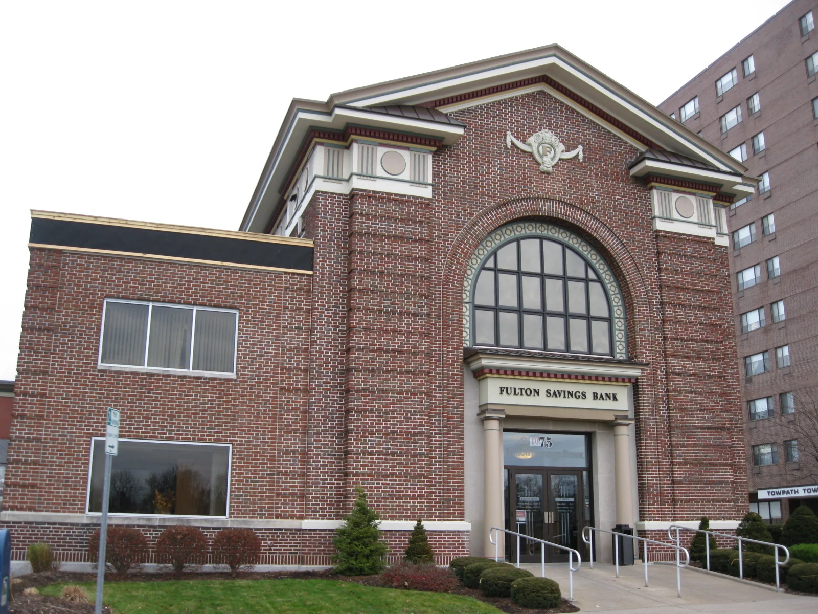 The brick Fulton Savings Bank building in downtown Fulton, New York