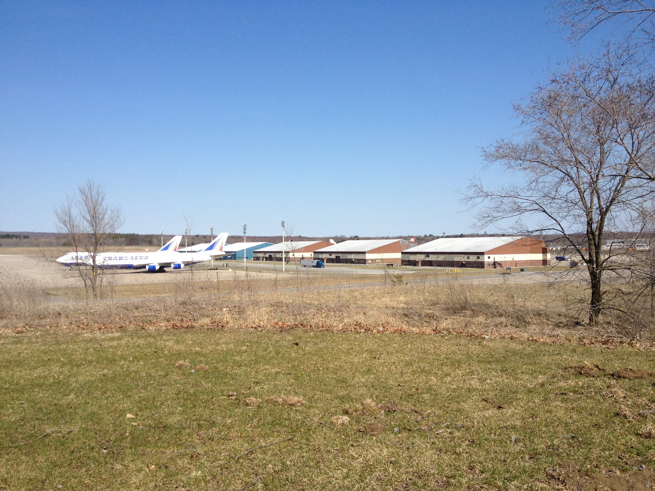 Jumbo jets parked near hangars at Griffiss International Airport in Rome, New York