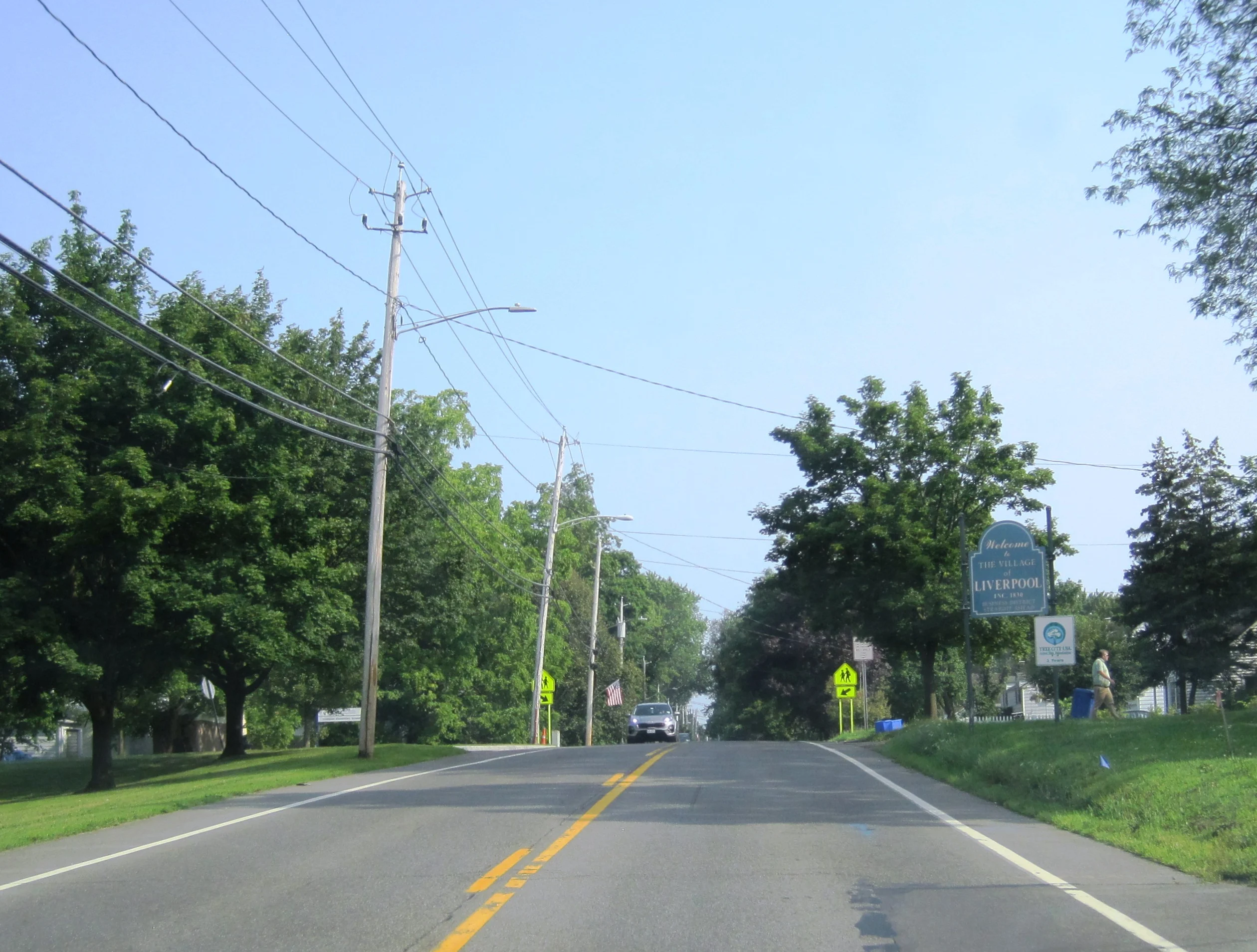 A state highway entering a village in Onondaga County, New York