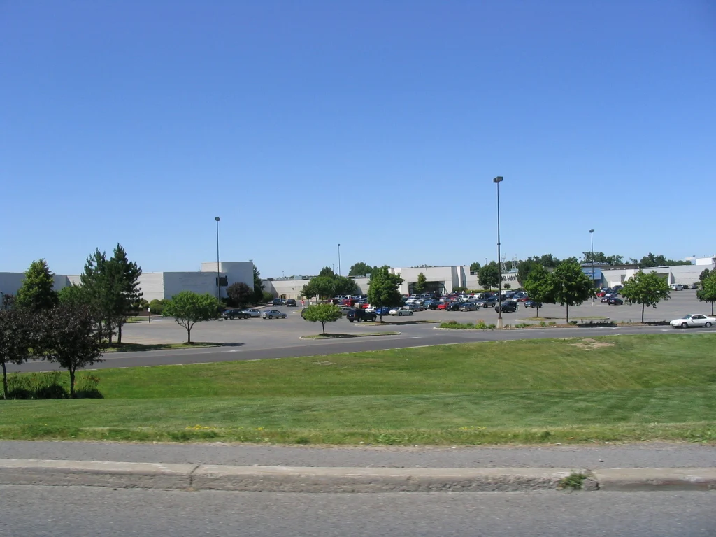A large low commercial building and parking lot in the town of Clay, New York