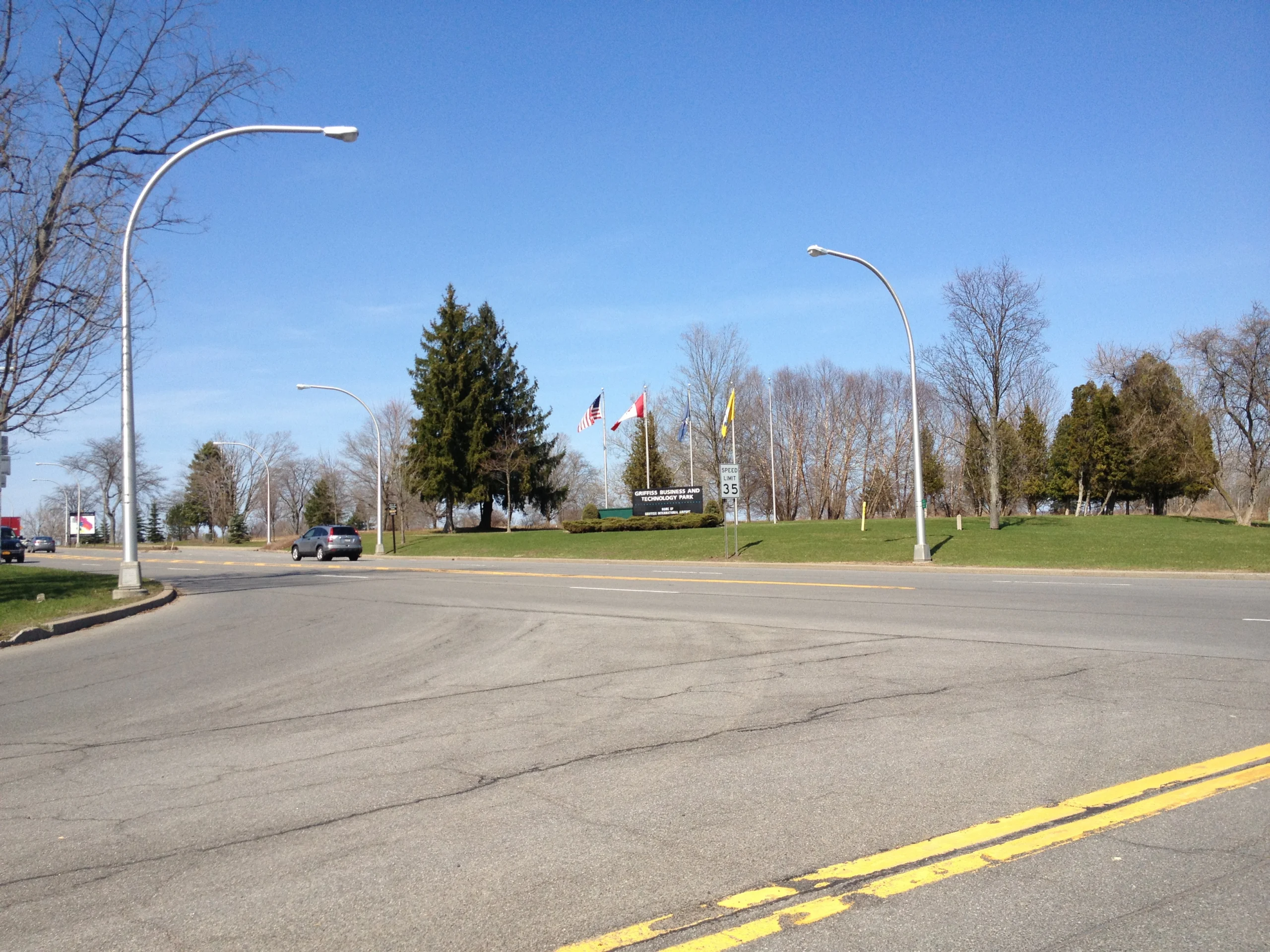 The entrance sign and flagpoles at Griffiss Business and Technology Park in Rome New York
