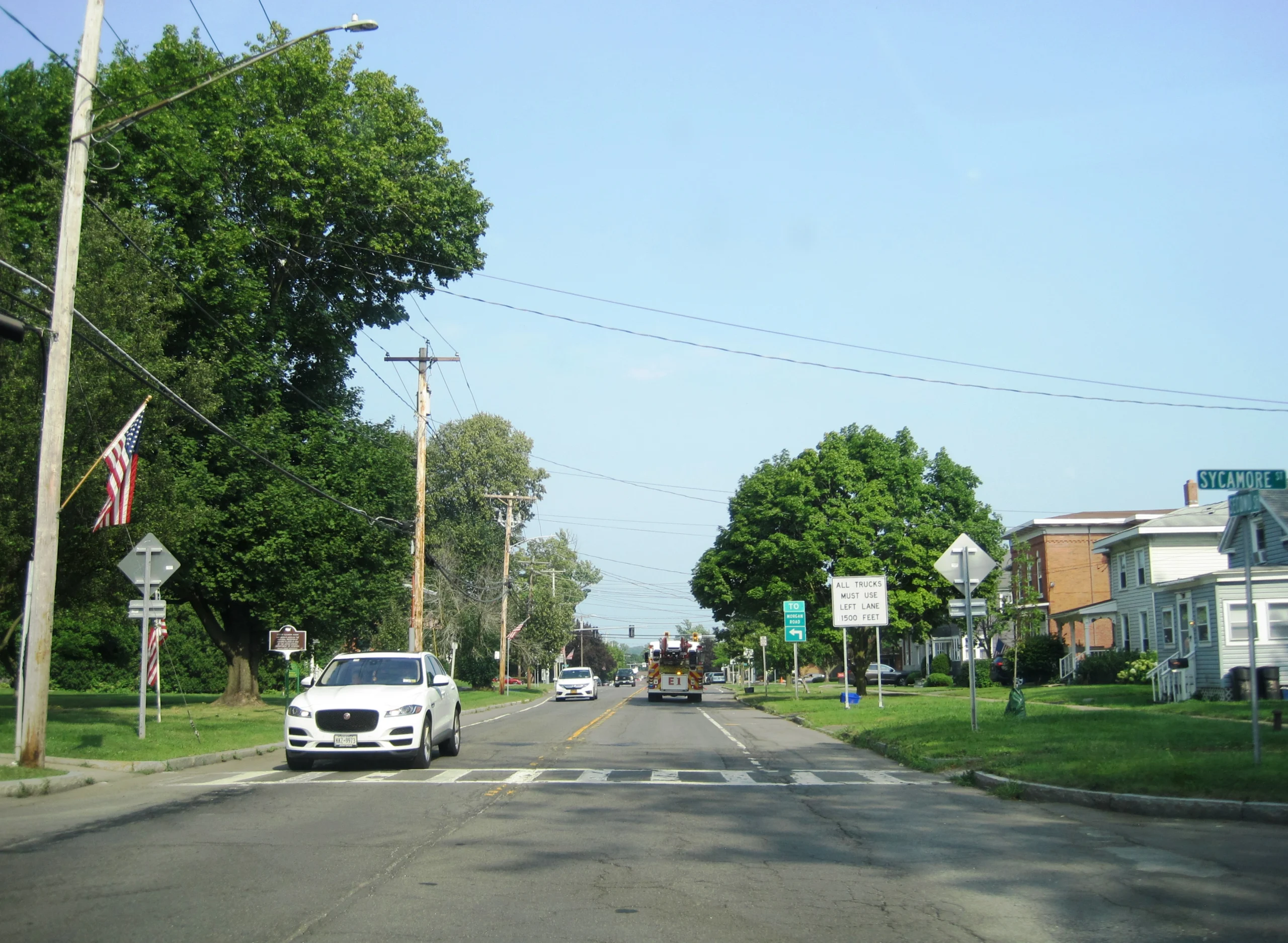 A state route through a commercial area in Onondaga County, New York
