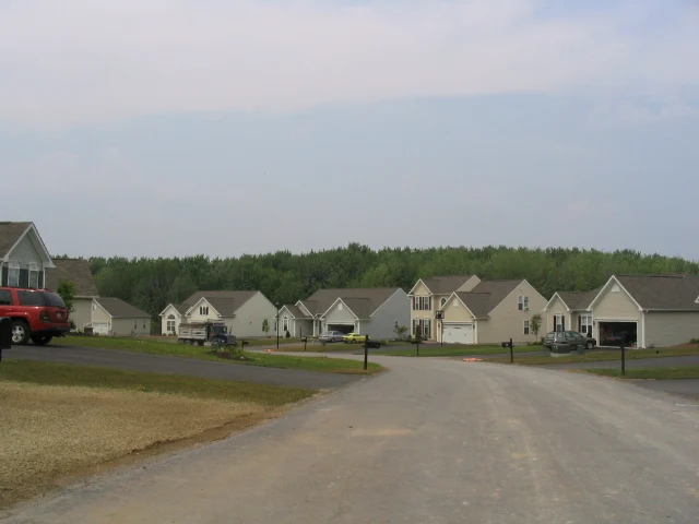 A street of newly built two story homes in the town of Van Buren New York