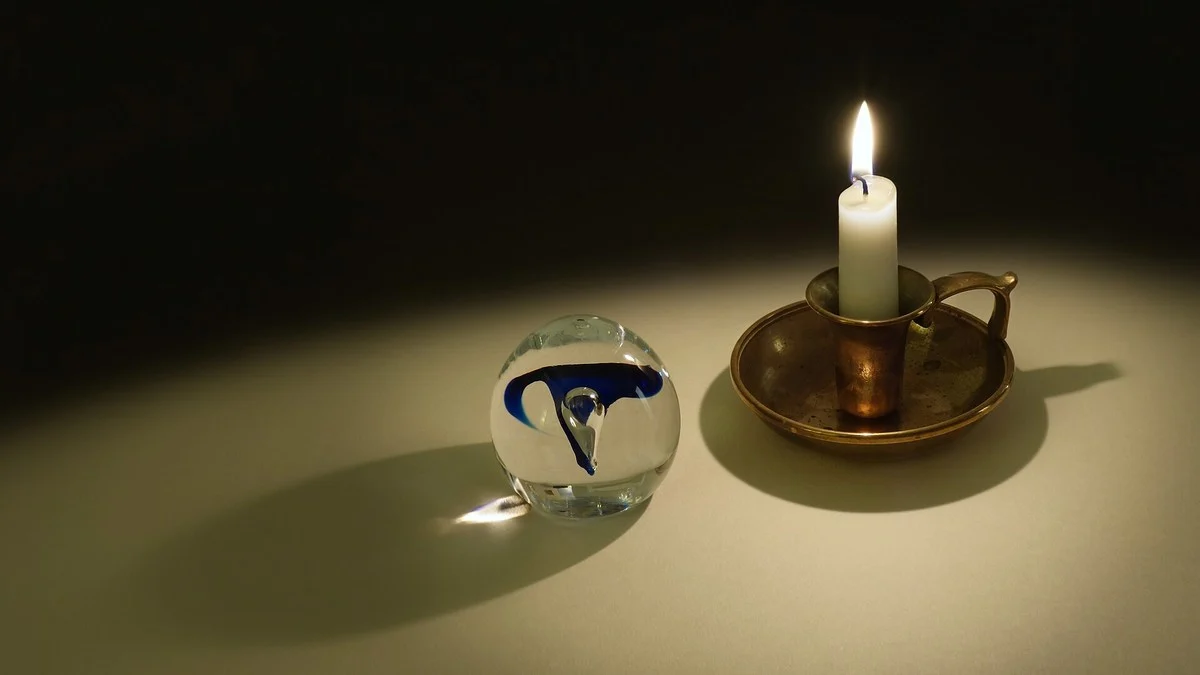 A candle flame photographed against a dark background.